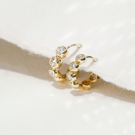 Wholesale 925 Sterling Silver Bezel Setting CZ Hoop Earrings (5 Sets) - A pair of wholesale 925 sterling silver hoop earrings with sparkling bezel-set cubic zirconia stones, displayed on a clean white background.