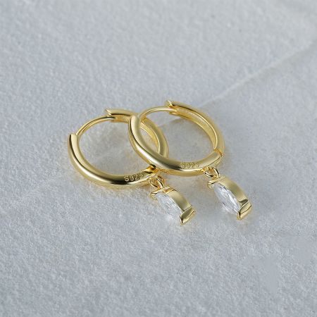 A detailed studio shot of the gold-plated sterling silver earrings with clear cubic zirconia drops.
