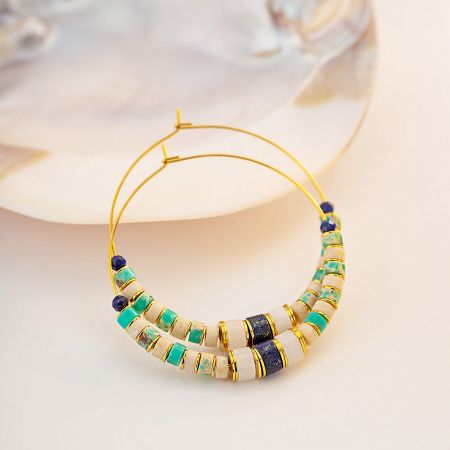 Stylish shot of the beaded hoop earrings, showcasing their intricate pattern and vibrant colors.