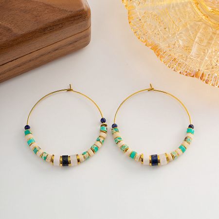 Another perspective of the gold hoop earrings, emphasizing the mix of turquoise, white, and dark blue beads.