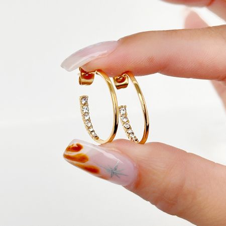 Stainless Steel Zirconia C-Shape Hoop Earrings - A pair of stainless steel C-shape hoop earrings with sparkling zirconia accents, displayed on a clean white background.