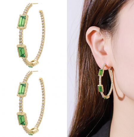 Elegant gold hoop earrings adorned with green gemstones and sparkling diamonds.