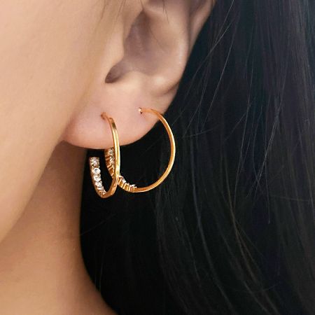 Model wearing the stainless steel C-shape hoop earrings, showcasing their elegant look.