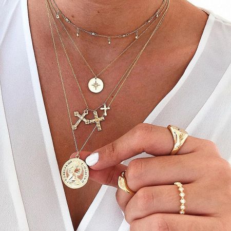 A lifestyle image showcasing the gold North Star necklace.