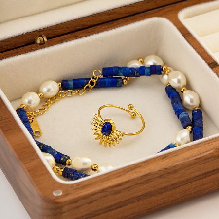 The sunburst ring shown as part of a larger jewelry collection.