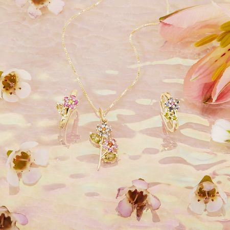 A collection of the floral earrings showcasing the different gemstone color options available.