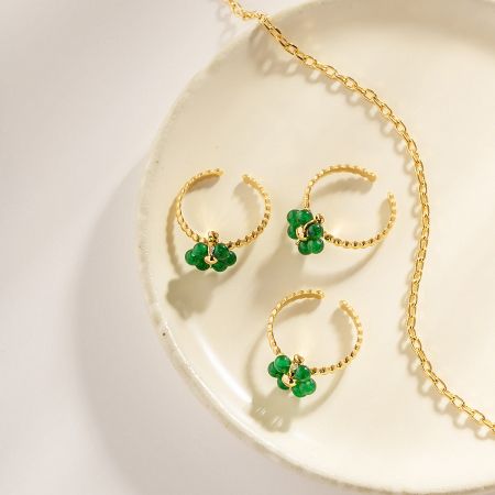 The complete set of five rings worn on a model's hand to showcase styling.