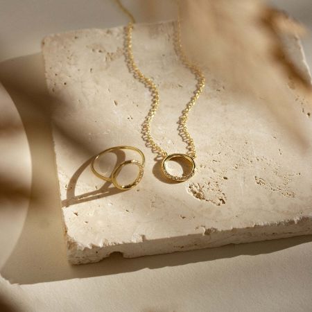 A beautifully styled set featuring the circle pendant necklace, perfect as a gift idea for a teacher or girlfriend.
