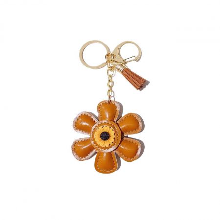 Detailed view of the gold keychain attachment on the orange sunflower charm.