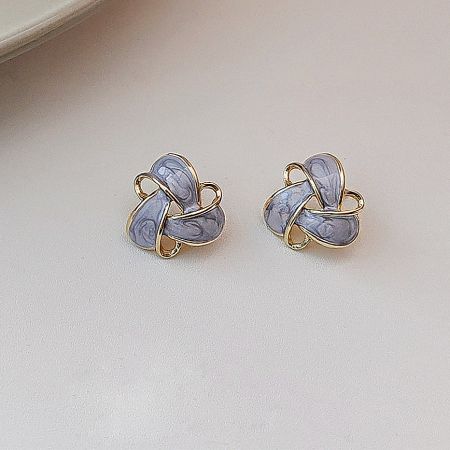 Elegant gold knot stud earrings accented with light purple stones.