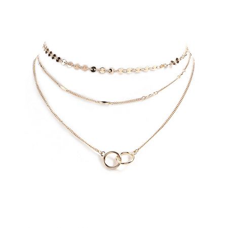 Linked Rings Layering Necklace - A close-up of the Linked Rings Layering Necklace, showcasing its three delicate gold-plated chains and the interlocking double circle pendant.