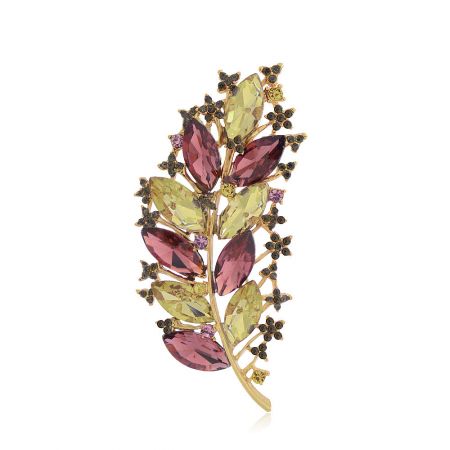 A stylish gold-toned leaf brooch adorned with yellow, pink, and black gemstones.