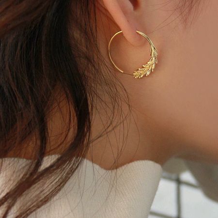 14K Gold Plated Brass Leaf Hoop Earrings Elegant Fashion Jewelry - A model wearing the elegant 14K gold plated brass leaf hoop earring, showcasing its delicate wheat-leaf design and shine.