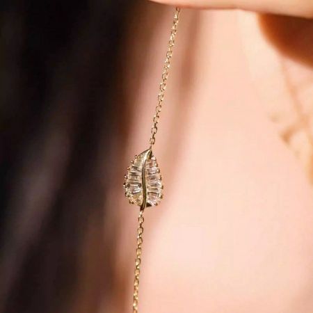 Another piece from the 5-bracelet set, showcasing the intricate leaf motif and brilliant stones.