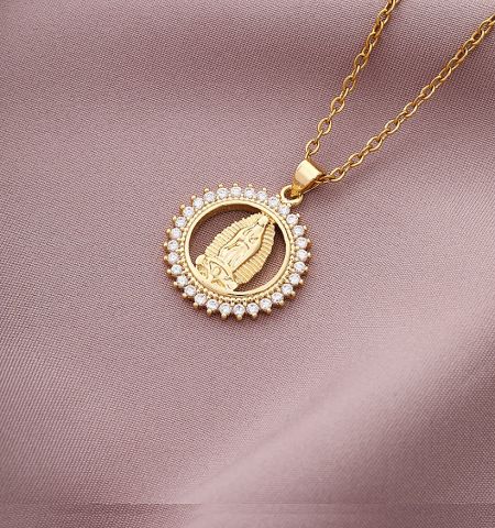 Elegant gold leaf-shaped Christian pendant necklace with a delicate chain and gemstone accents.