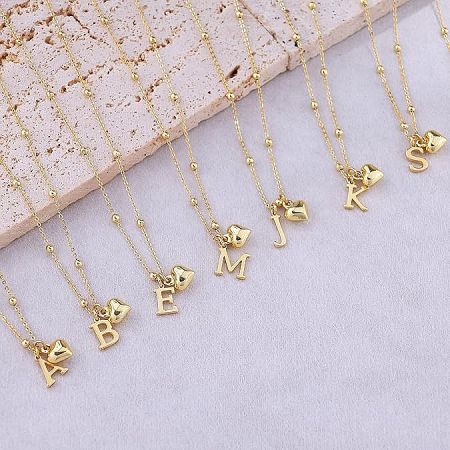 A collection of 14K gold plated initial necklaces with heart pendants, showcasing various letters.