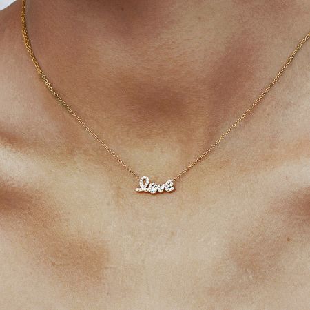 Set of 5 Dainty Gold Love Necklace with Cubic Zirconia Pendant in Stainless Steel - Model wearing a dainty gold love necklace with a sparkling cubic zirconia pendant, crafted from anti-tarnish stainless steel. Perfect for Valentine's Day gifting.