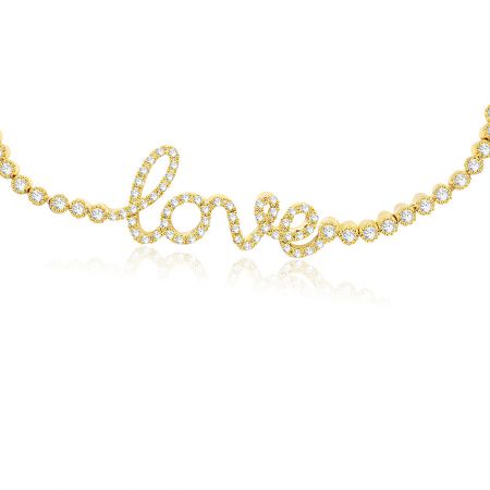 A matching gold necklace with a diamond-encrusted 'love' pendant, part of the same collection.
