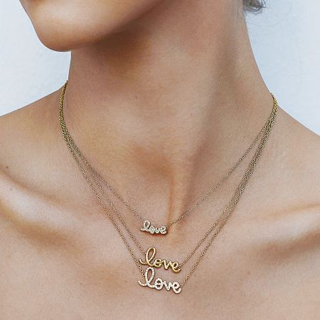 Layered view of three gold love necklaces, demonstrating how to style the stainless steel choker chains for a modern look.