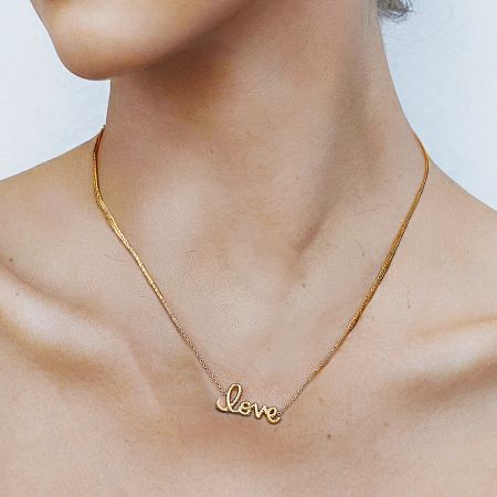 Set of 5 Gold Love Pendant Necklace Stainless Steel Waterproof Anti Tarnish Choker Jewelry for Her - A woman wearing the elegant gold 'Love' pendant necklace, showcasing its delicate stainless steel chain and romantic design.