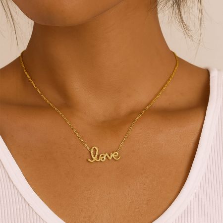 Top-down view of the gold 'Love' pendant necklace, perfect as a romantic gift for her.