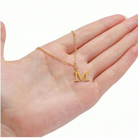 Trendy Minimalist English Letter Necklace Set of 5 - A close-up of the Trendy Minimalist English Letter Necklace, featuring a gold 'M' initial pendant on a delicate stainless steel chain.