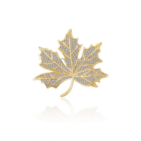 Gold Plated Maple Leaf Brooch - A close-up of the Gold Plated Maple Leaf Brooch, showcasing its detailed design and sparkling white cubic zirconia stones on a brass base.