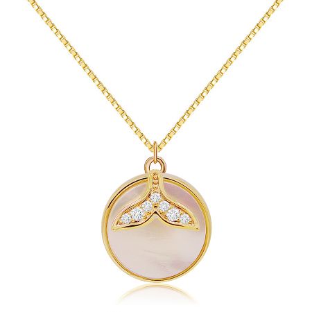 A detailed view of the gold necklace with its distinctive mermaid tail pendant.