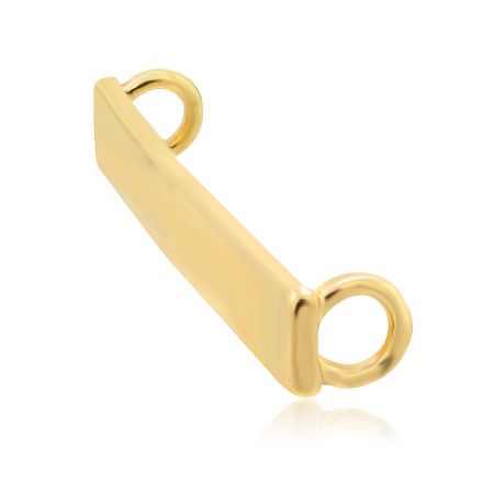 Close-up of the gold shoelace charm's connector loops for threading laces.