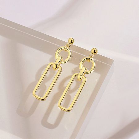 Close-up of the modern design elements: a ball, ring, and rectangular link.