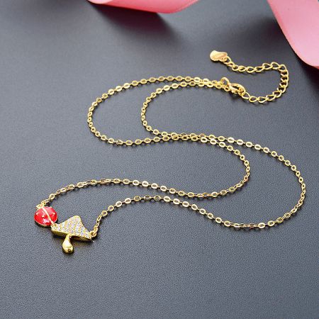 925 Sterling Silver Mushroom and Ladybug Pendant Necklaces Set of 5 - A close-up of a 925 sterling silver necklace with a gold finish, featuring a charming mushroom-shaped pendant with a red gemstone accent.