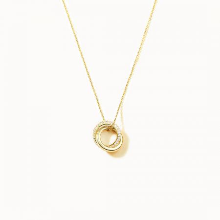 The Eternal Circles necklace in a regal gold finish, featuring the interlocking circle pendant with sparkling zircons.
