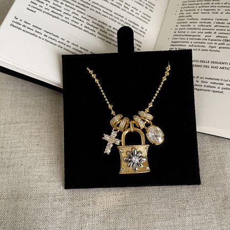 Detailed view of the gold padlock charm necklace with sparkling zircon stones, ideal for fashion jewelry collections.