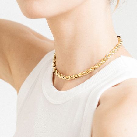 Clear product shot of the gold twisted rope necklace against a neutral background.