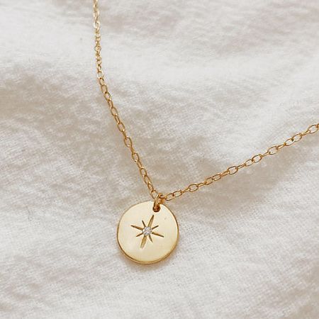 925 Sterling Silver North Star Pendant Necklace Set of 5 - Close-up of the 925 sterling silver North Star pendant necklace in a radiant gold finish, showcasing the detailed starburst design.