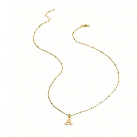 The minimalist necklace featuring a gold 'A' initial pendant.