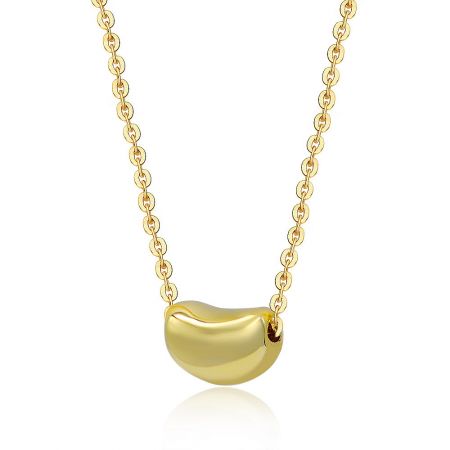 Luscious Gold Bean Necklace - Close-up of the Luscious Gold Bean Necklace, showing the polished gold-plated bean-shaped pendant on its delicate chain.