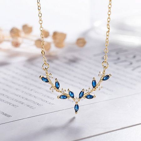 Another angle of the leaf-inspired pendant, showing its intricate craftsmanship and sparkle.