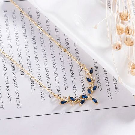 The full necklace laid out to display its length and the pendant's position.