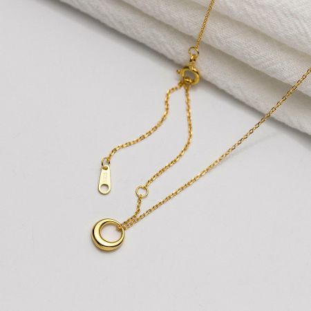 Close-up of the gold minimalist necklace clasp, showing the S925 sterling silver stamp.