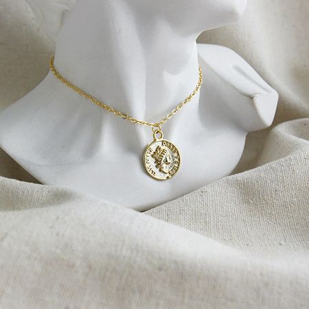 Close-up of the gold vintage coin portrait choker necklace, highlighting the detailed Elizabeth profile.