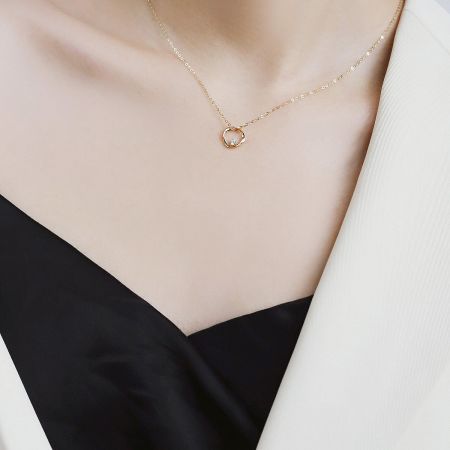 Full view of the sterling silver necklace and circular Mobius pendant.