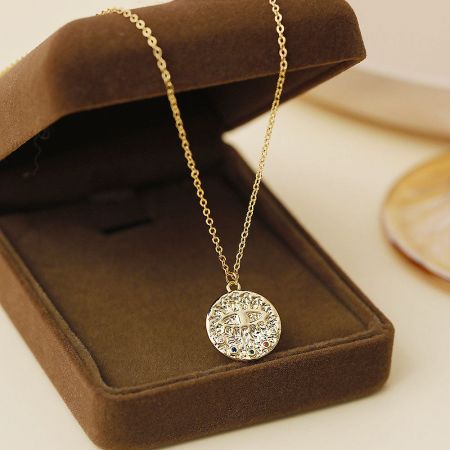 Promotional shot of the decorative evil eye pendant necklace in a presentation box.