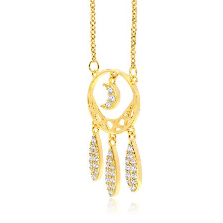 Close-up of the intricate crescent moon pendant with diamond-encrusted elements on the gold necklace.