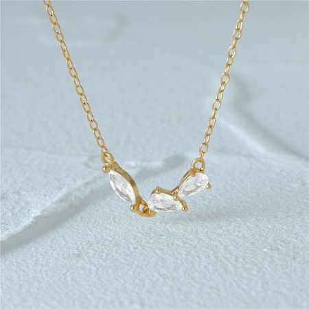 925 Silver Geometric Cluster Zircon Necklace Set of 5 - A close-up of the 925 silver geometric cluster zircon necklace in a radiant gold finish, showcasing the sparkling crescent-shaped pendant.