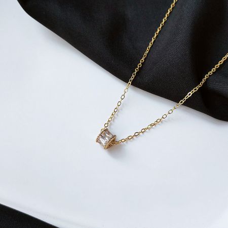 Another design from the gold-plated choker set, showcasing a clear crystal pendant.