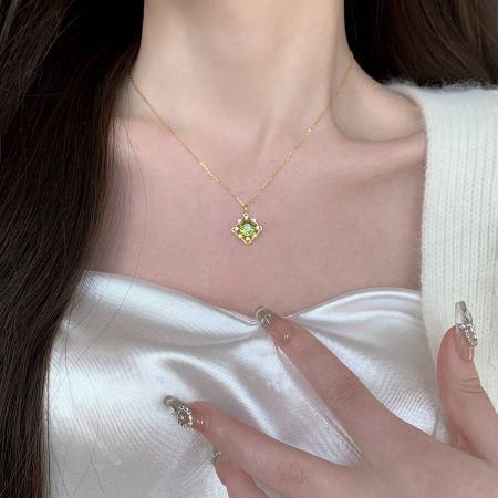 925 Sterling Silver 14K Gold Plated Green Zircon Pendant Necklace Set of 5 - A close-up of the 925 Sterling Silver 14K Gold Plated Green Zircon Pendant Necklace, showcasing the vibrant green stone and delicate gold chain.