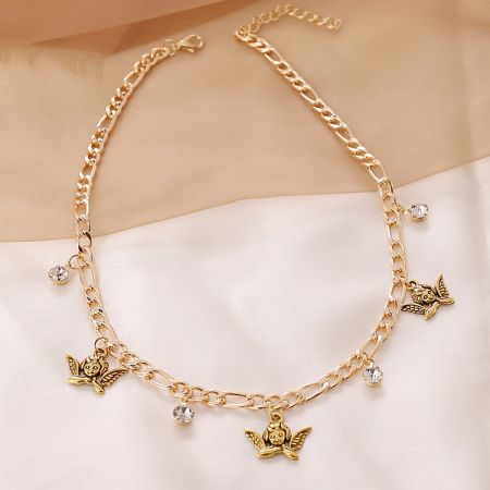 Full view of the gold chain necklace, showing its length and various charms.