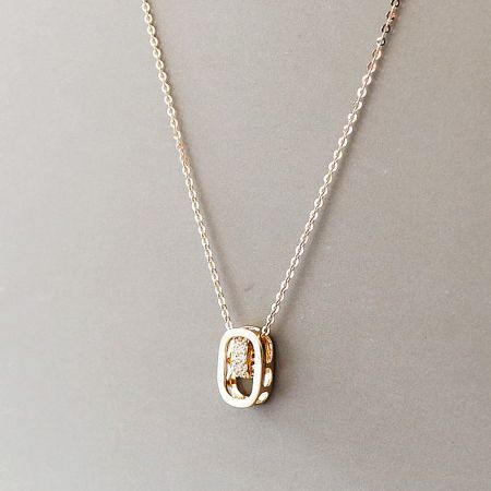 Close-up shot of the pendant's texture and the surrounding cubic zirconia.