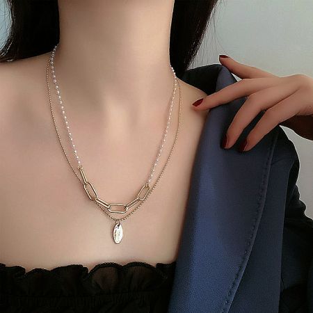 Another angle of the White Pearl Strand Necklace, showing the clasp and extension chain.